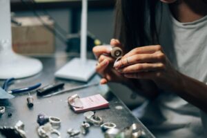 the girl works on a jewelry in the workshop wgur6kq.jpg